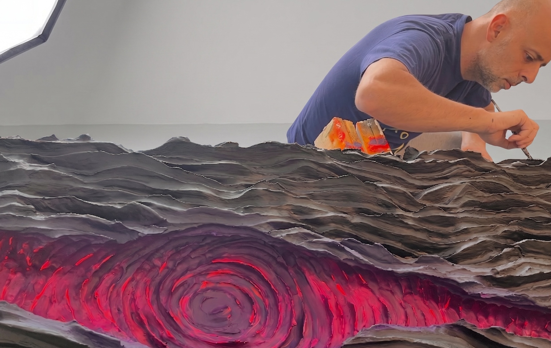 Sculptural detail, a swirling magenta vortex